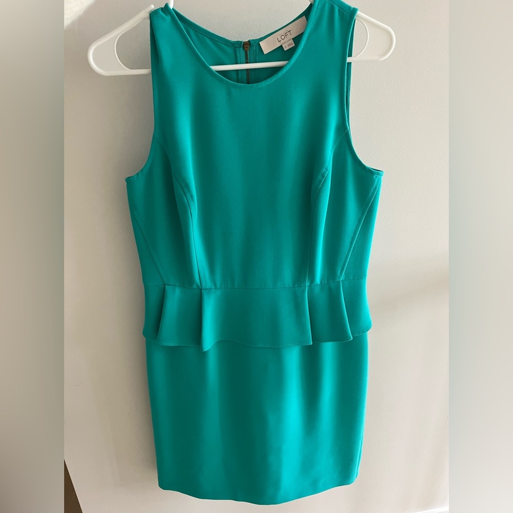 Green peplum dress
